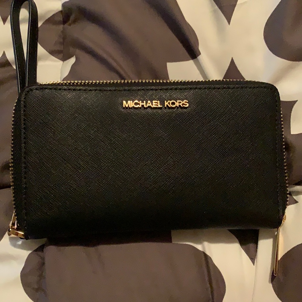 Black and gold Michael Kors wristlet wallet.